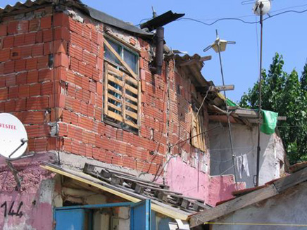 An informal settlement in Istanbul, Turkey. Known as gecekondu because they are “built at night,” this squatter housing takes advantage of an ancient law that says if construction begins after sundown, whatever is standing at sunrise has legal status. According to Robert Neuwirth, half the residents of Istanbul””perhaps six million people””live in gecekondus, photo by Amal Cavender (2005).